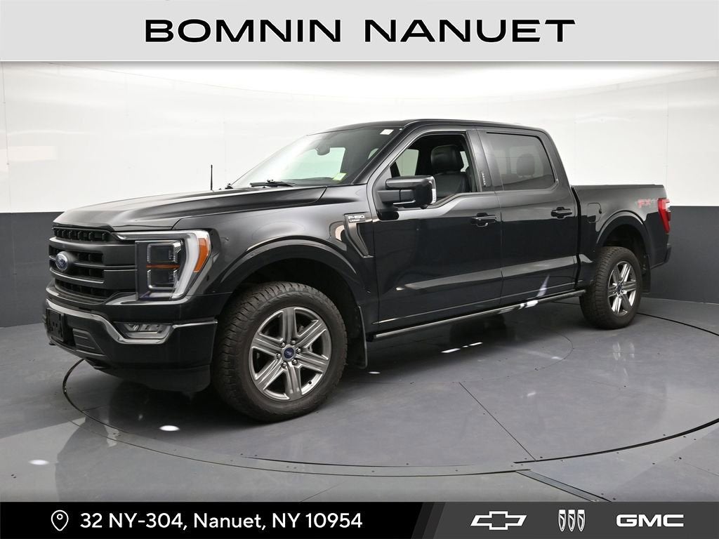 2021 Ford F-150 LARIAT in Black — front three-quarter view
