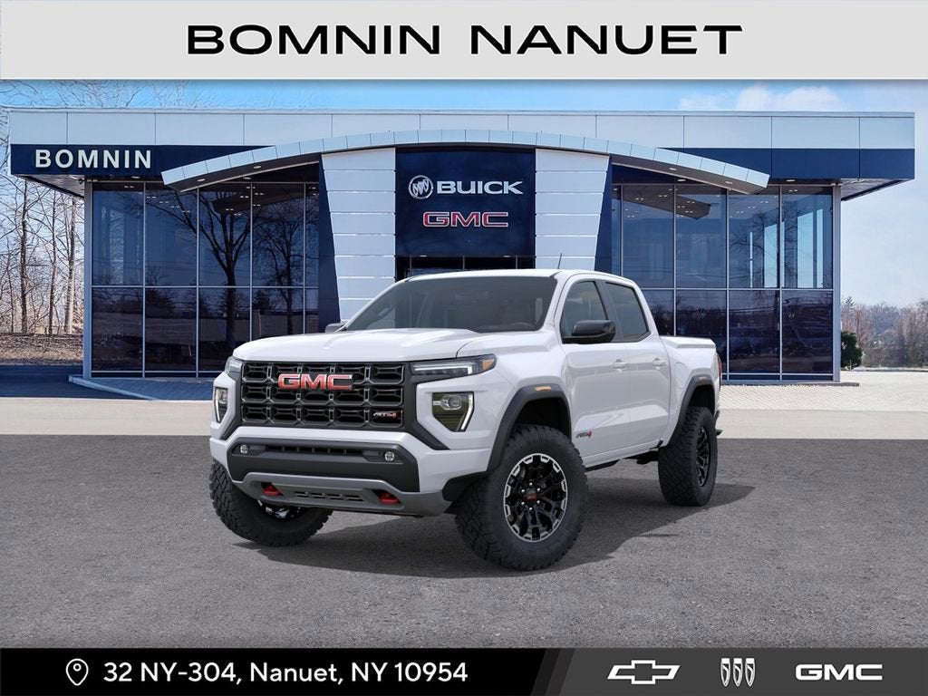 2026 GMC Canyon AT4 in Summit White — front three-quarter view