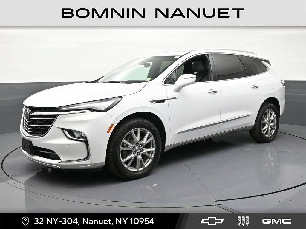 2023 Buick Enclave Essence in Summit White — front three-quarter view