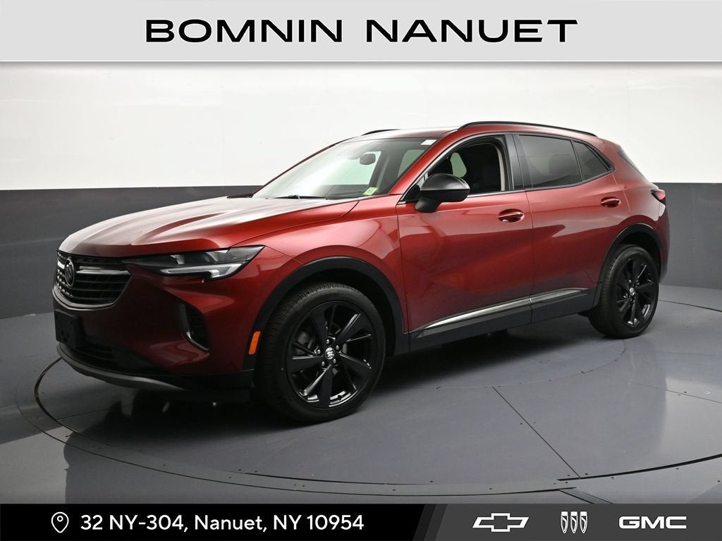 2023 Buick Envision Essence in Cinnabar Metallic — front three-quarter view